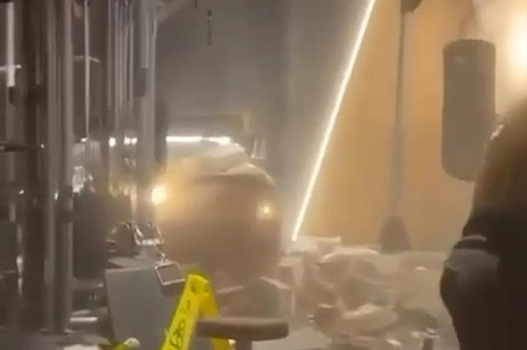 Horrifying video shows scenes of chaos after car smashes into busy JD gym