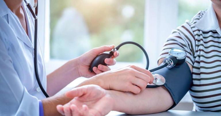 Doctor measures the pressure of the patient during a medical examination and consultation in the hospital