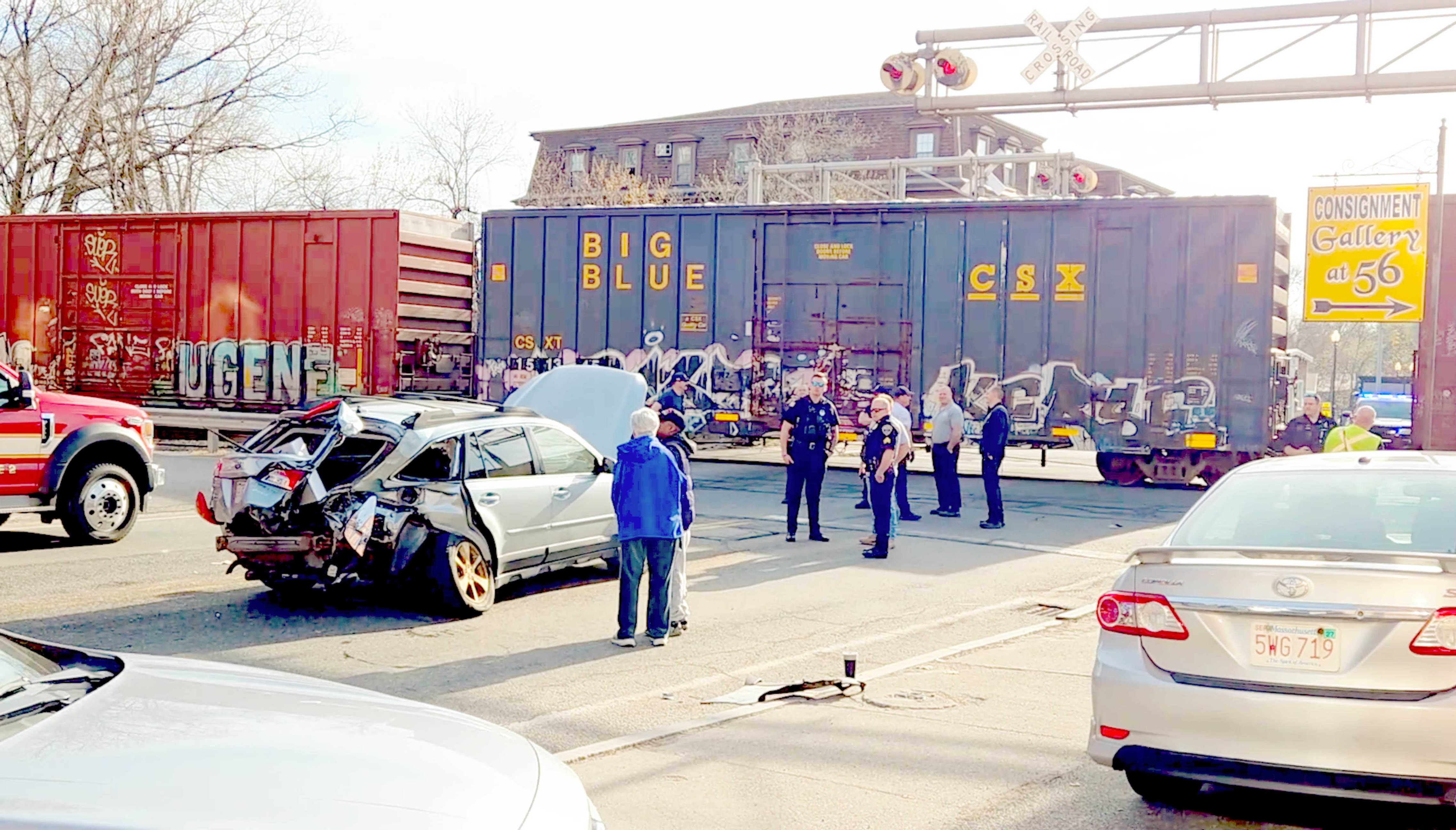 Freight train collides with vehicle at Mass. railroad crossing