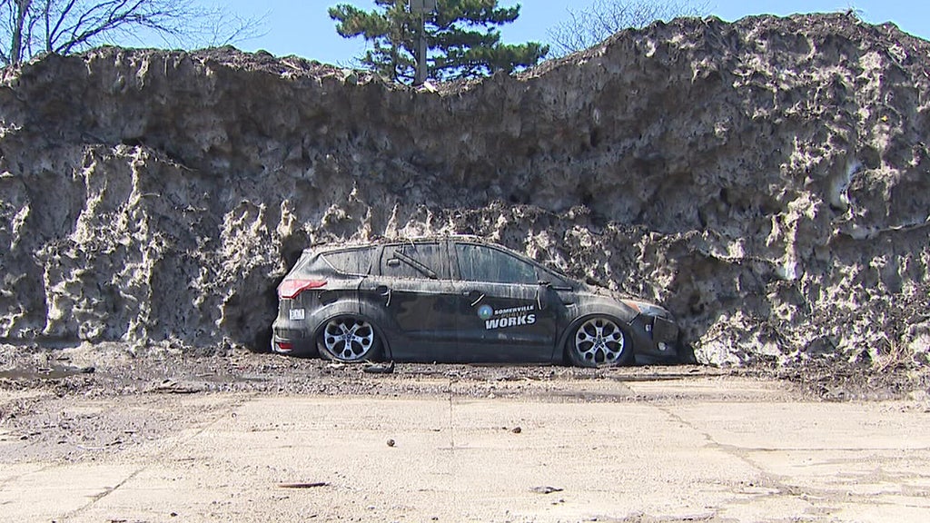 Crushed car emerges from massive pile of melting snow in Somerville ...