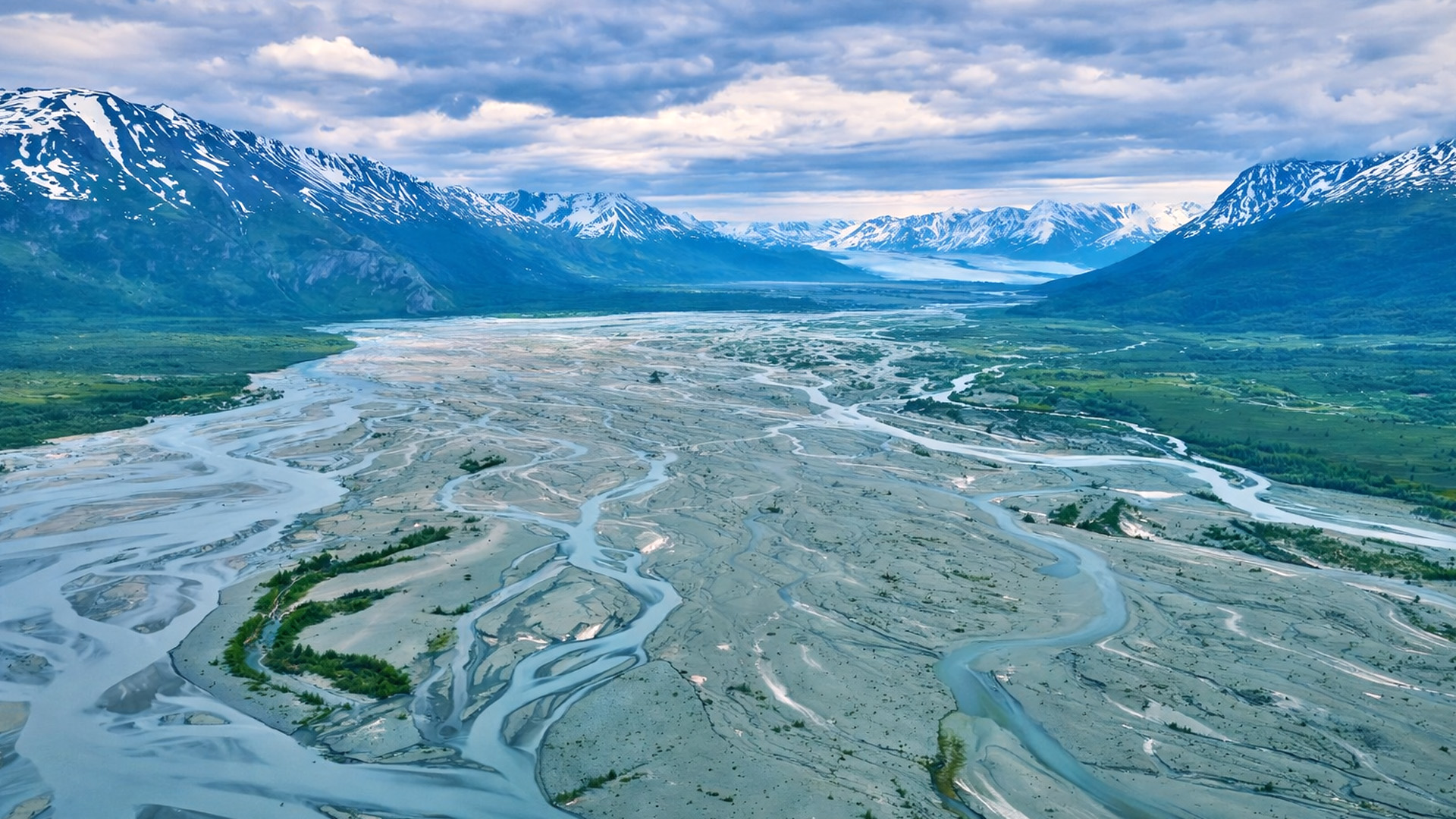 A glacier river winding through Alaska’s vast landscape
