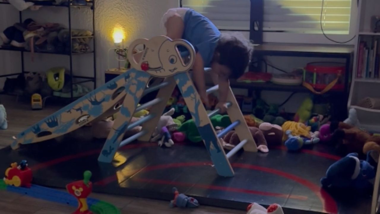 Little boy goes down a slide in the wrong way and ends with a fall