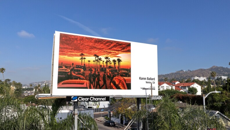 Artists take over LA billboards with dreamy portraits and orange ...