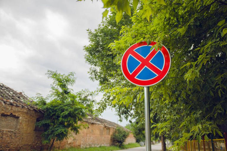 Drivers urged to learn meaning of 'blue and red cross' road sign ...