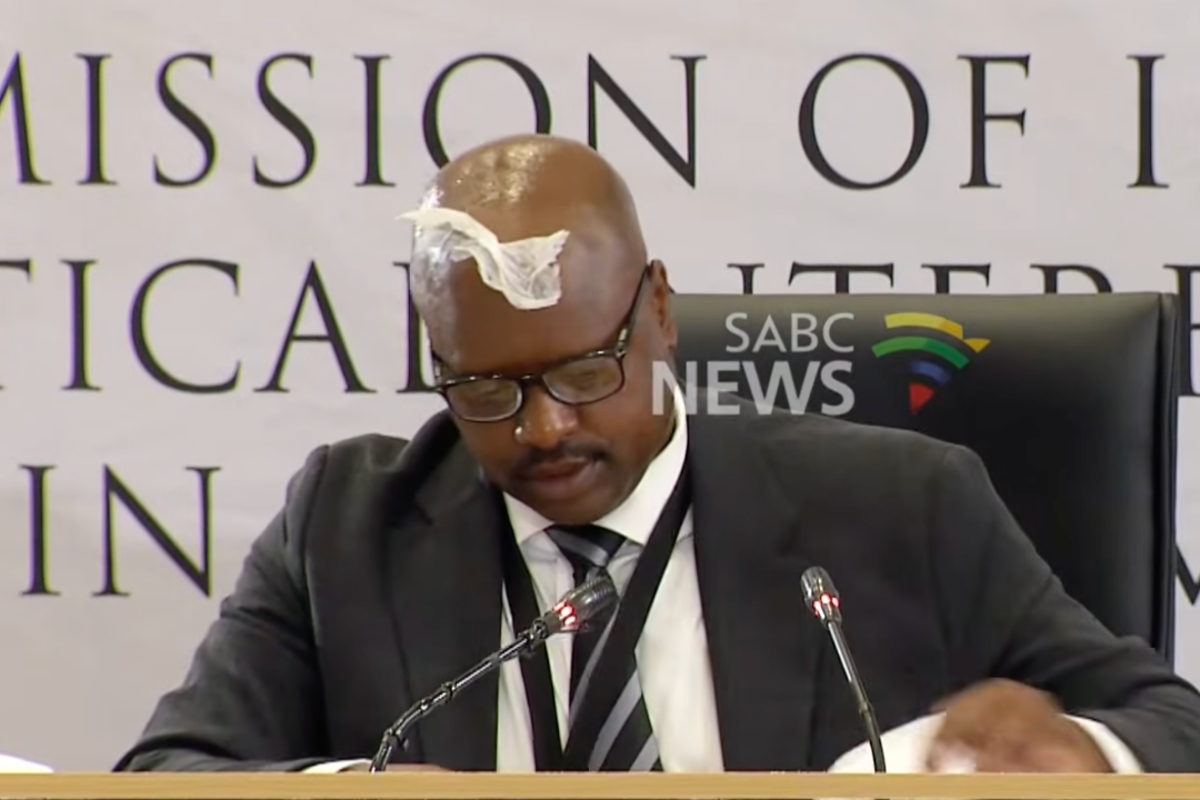 Ex-police chief gets tissue stuck on forehead during inquiry