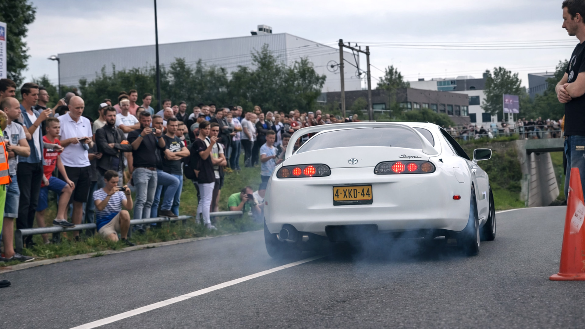 Toyota Supra slides close to crowd during acceleration