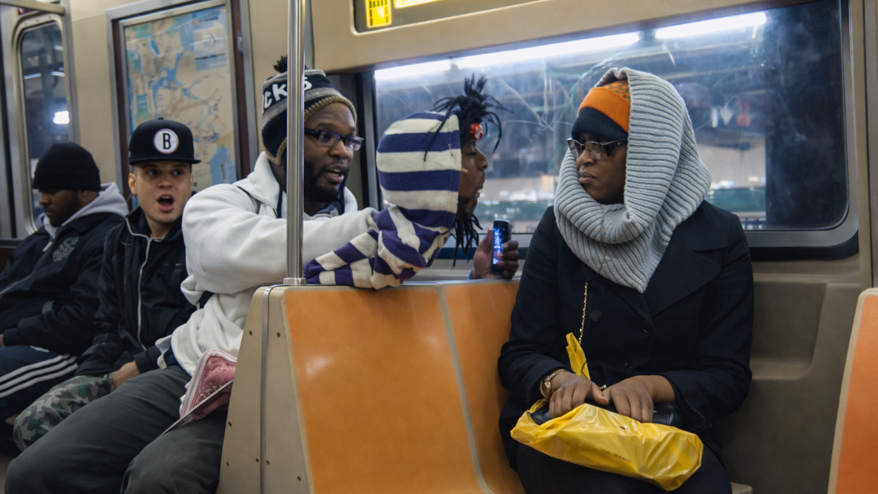 Puppet flirts with girls on the subway train