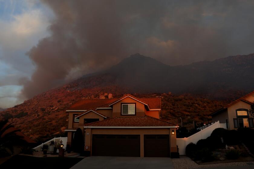 Firefighters contain Southern California brush fires fueled by Santa ...