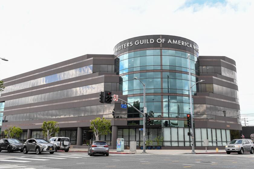Writers Guild forges tentative contract deal with studios