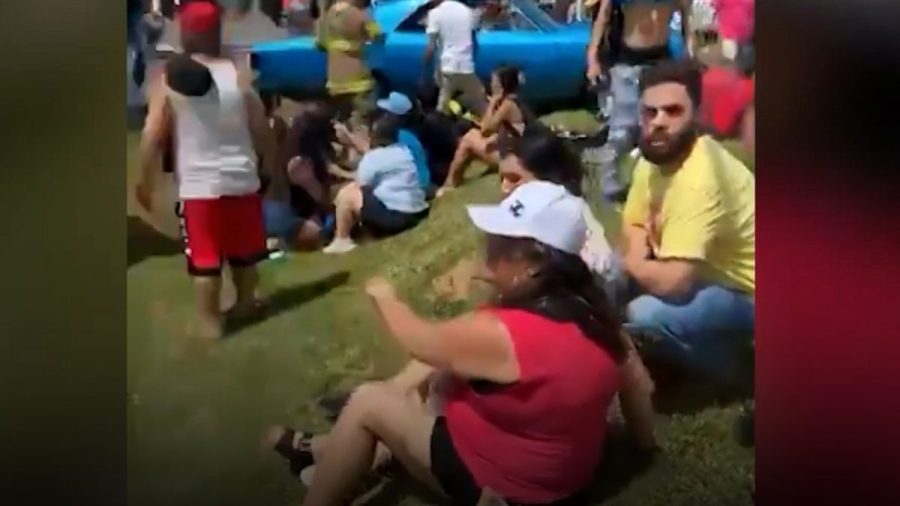 Man arrested after several injured when vehicle drove into crowd at ...