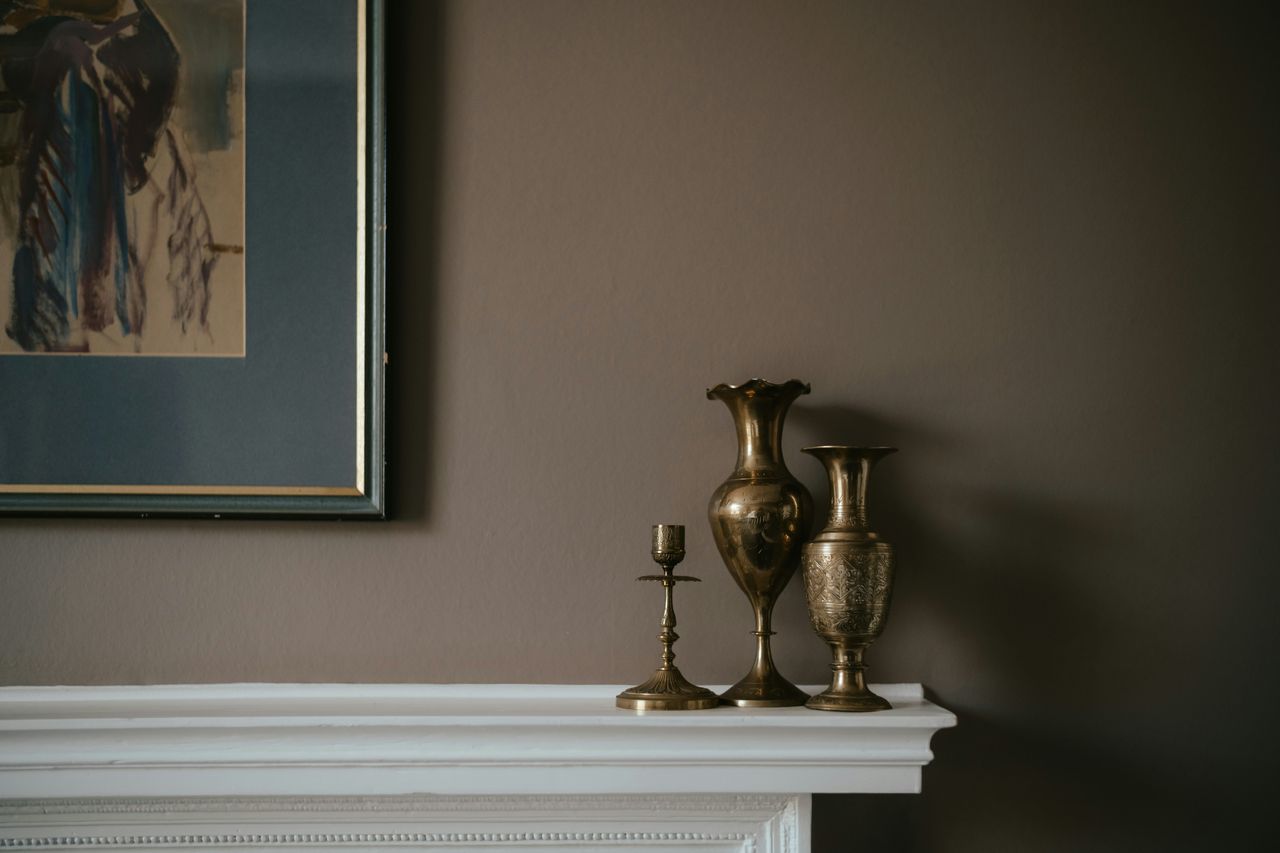 Brass goods on a mantel
