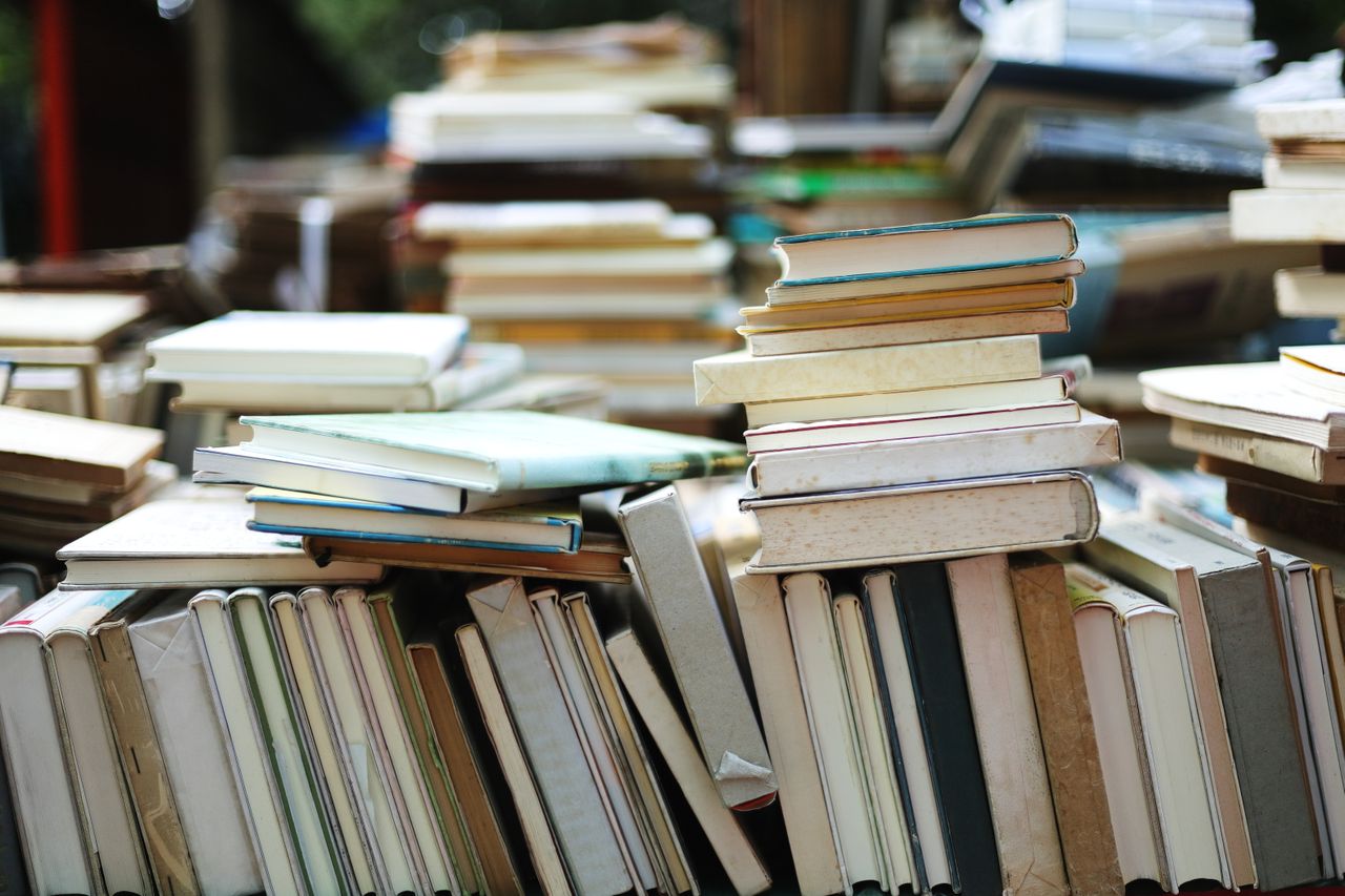 pile of old secondhand thrift store vintage flea market books