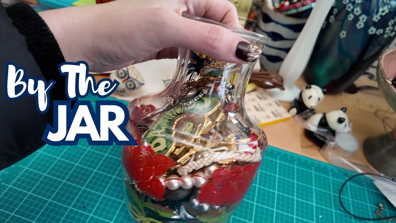 Expert thrifter packs custom jewelry jars for upcoming sale