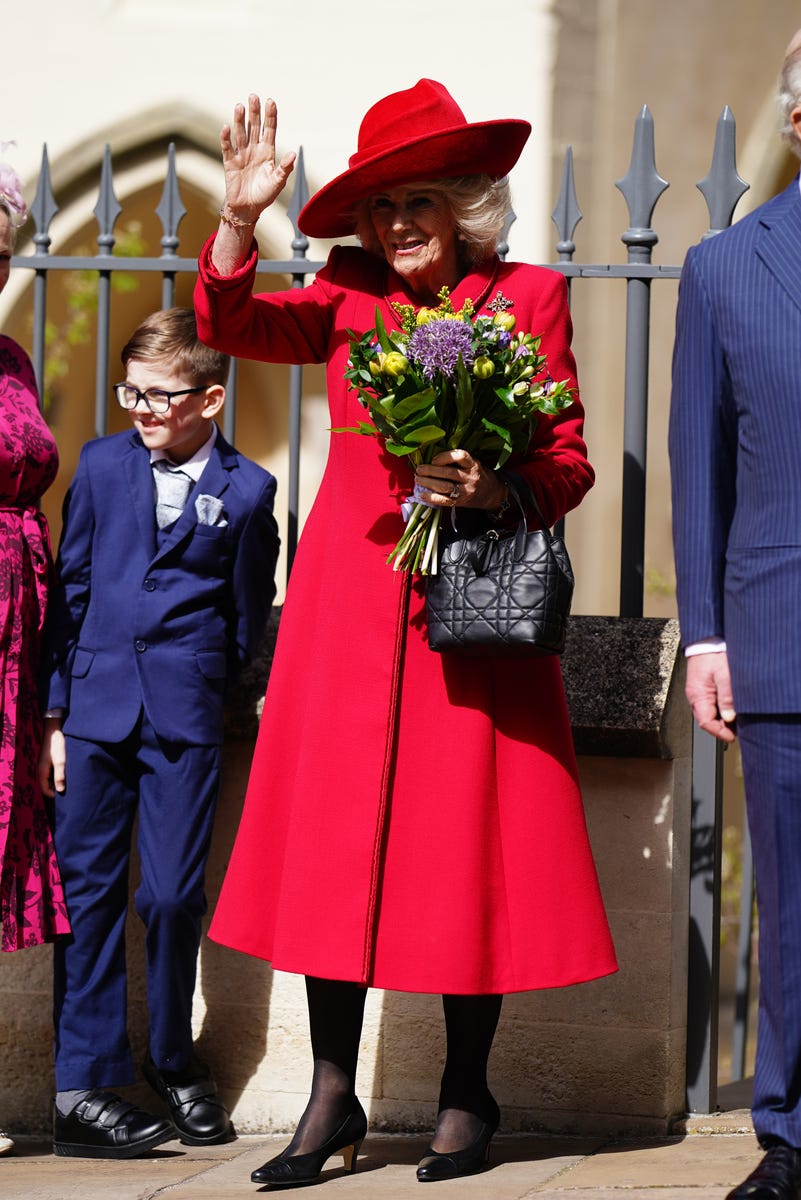 The Queen waves to the crowd gathered outside of the chapel.