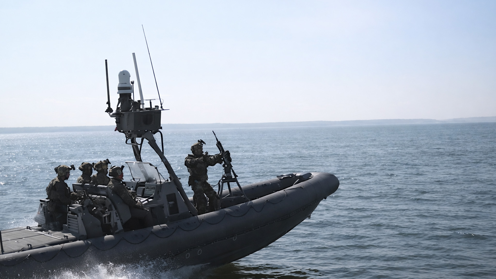 US Coast Guard practices live fire and boat raids