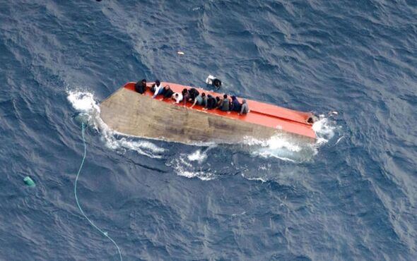 Horror as 70 feared missing and two dead after wooden migrant boat ...