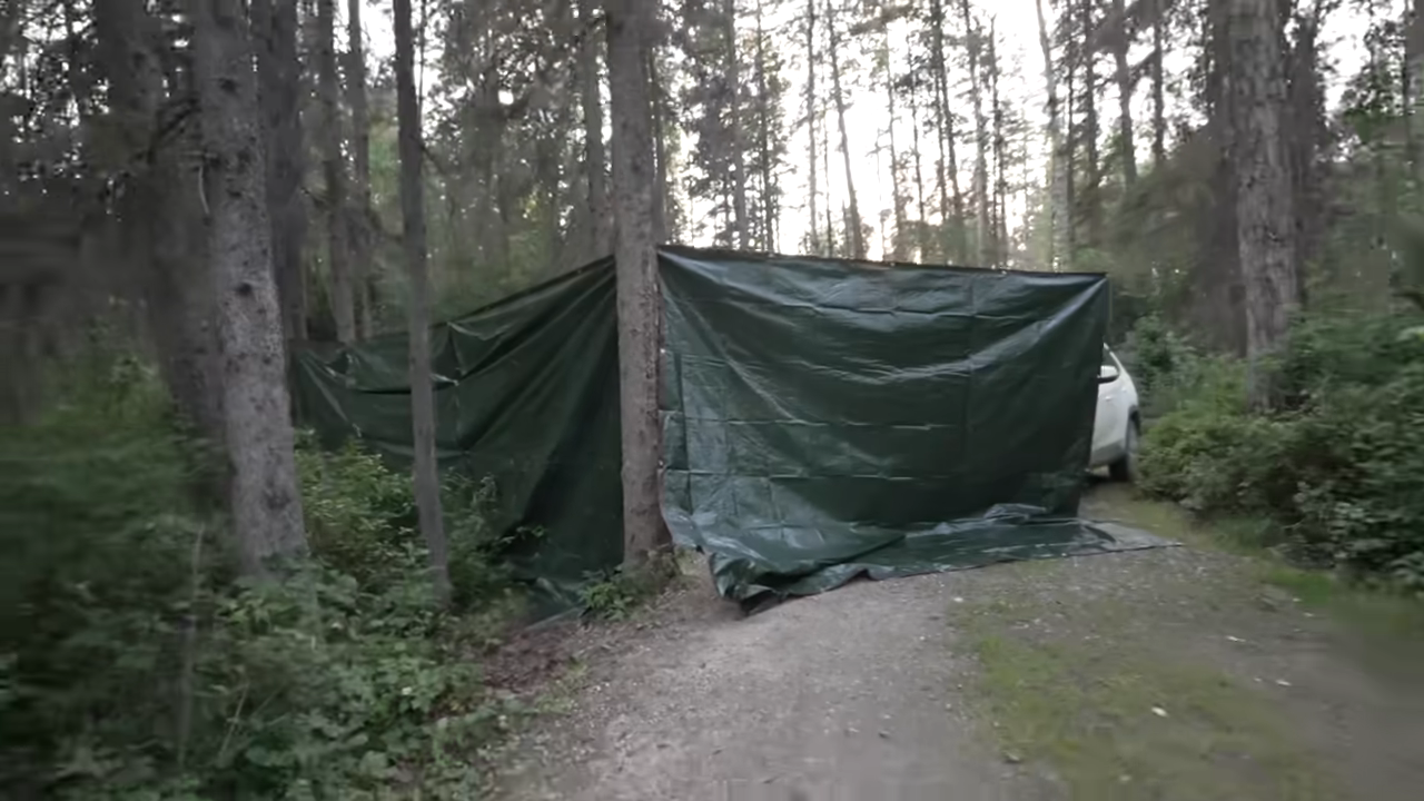 Huge tarp wall in campground - then we looked inside