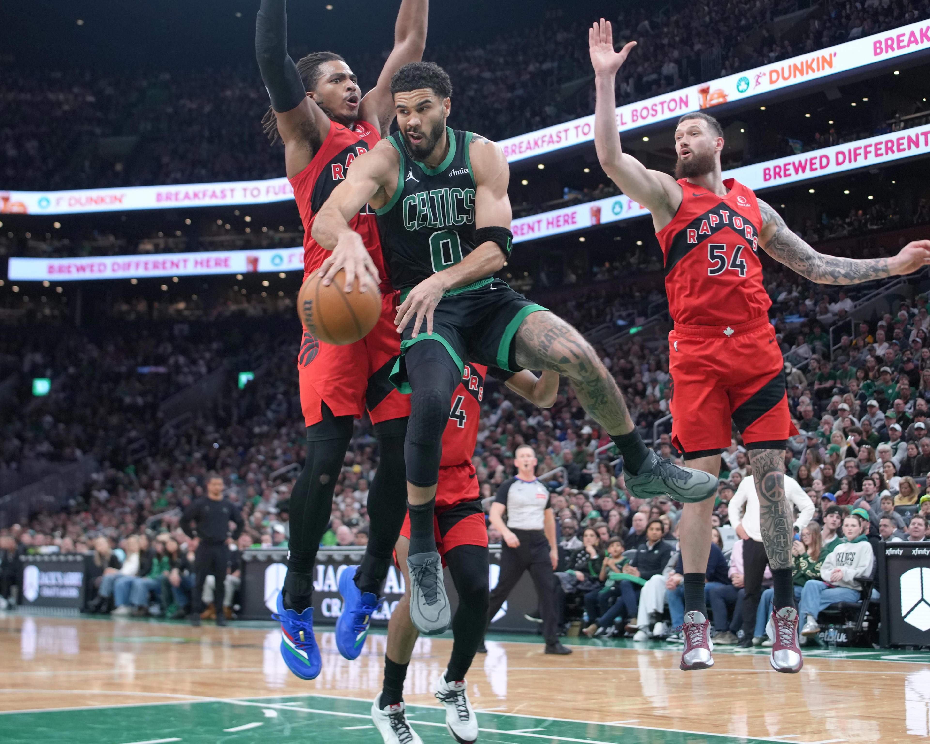 Boston Celtics snap into form late to beat Toronto Raptors at home (photos)