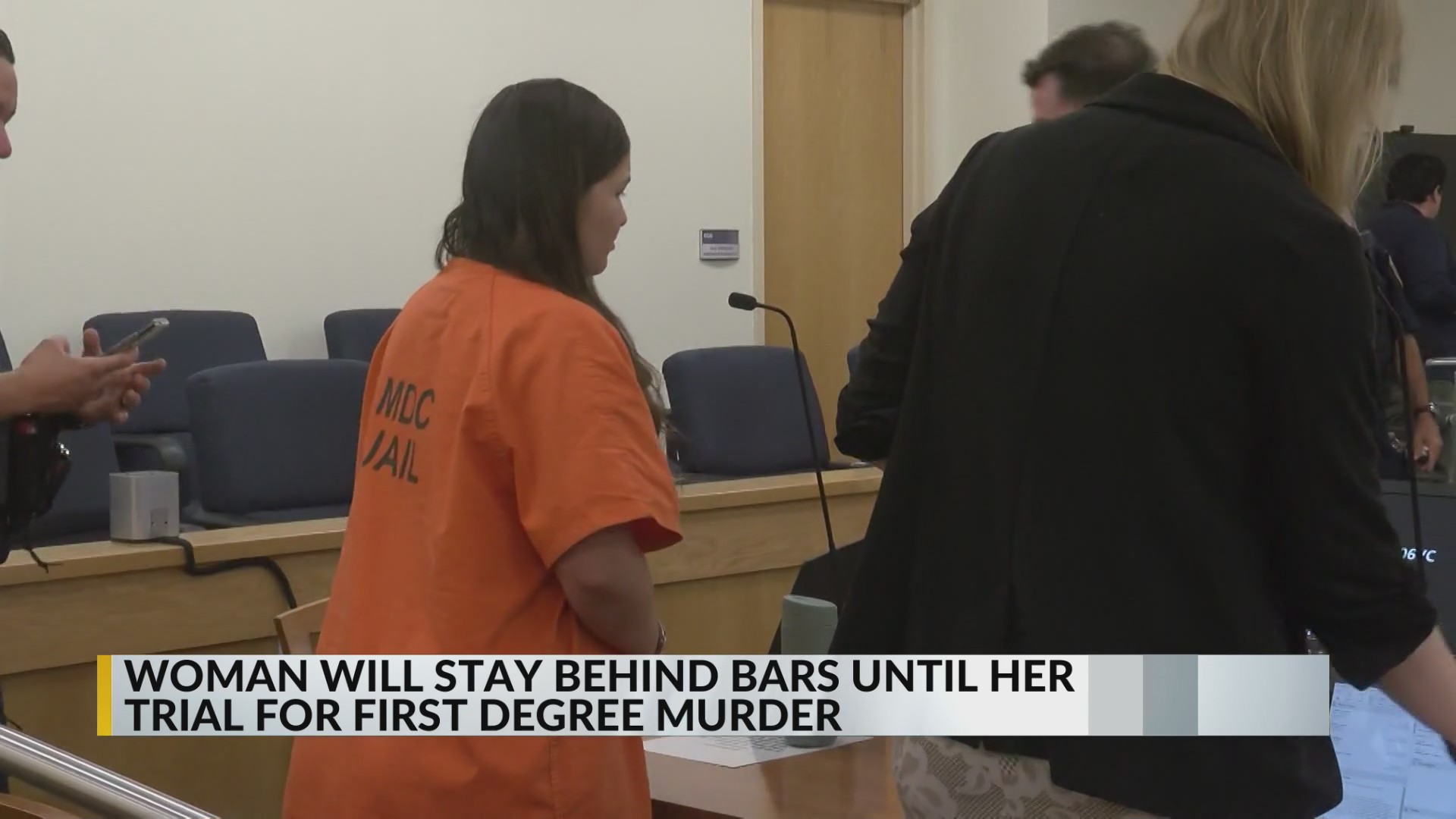Albuquerque woman accused of killing her dad will remain behind bars