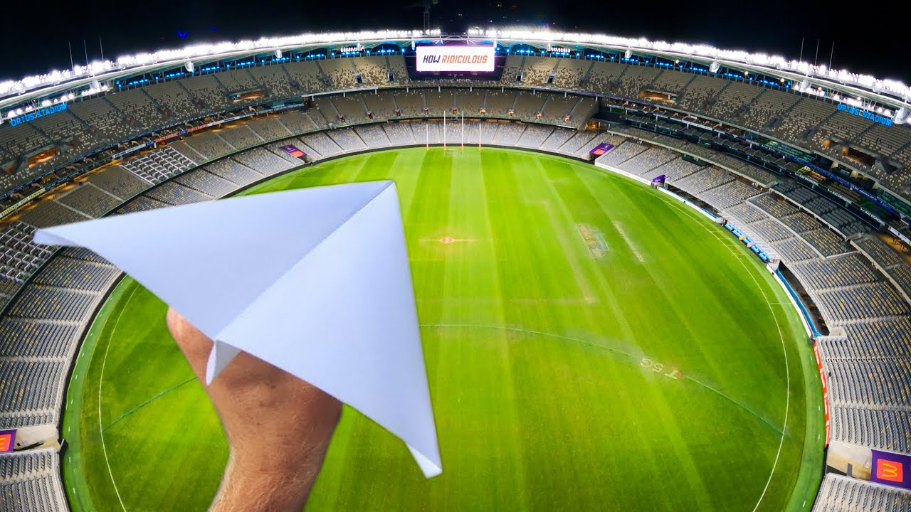 Watch what happens when a paper plane flies across a whole stadium