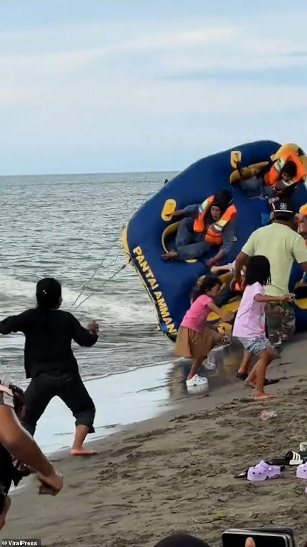 Flipping hell! Five tourists are flung through the air when 'donut boat ...
