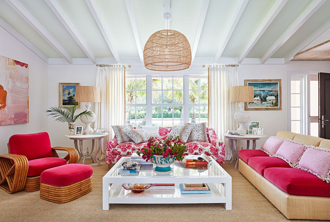 White Living Room with Pink Sofa and Chairs