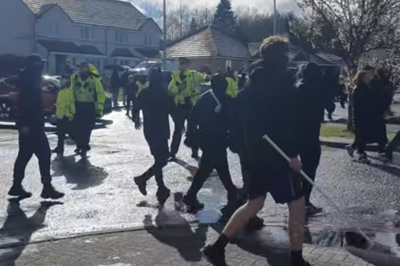 balaclava-clad-fans-seen-with-poles-ahead-of-hearts-match-against
