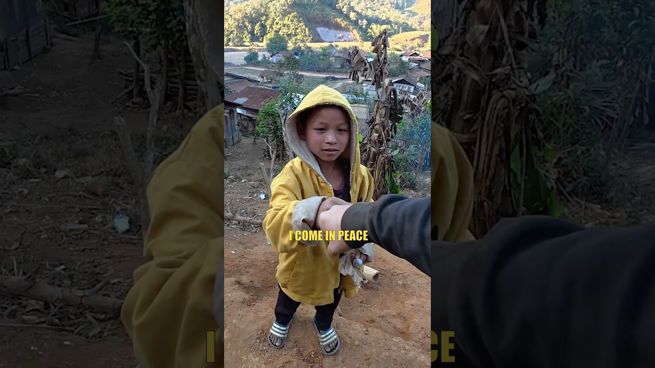 Laos child meets a visitor for the first time