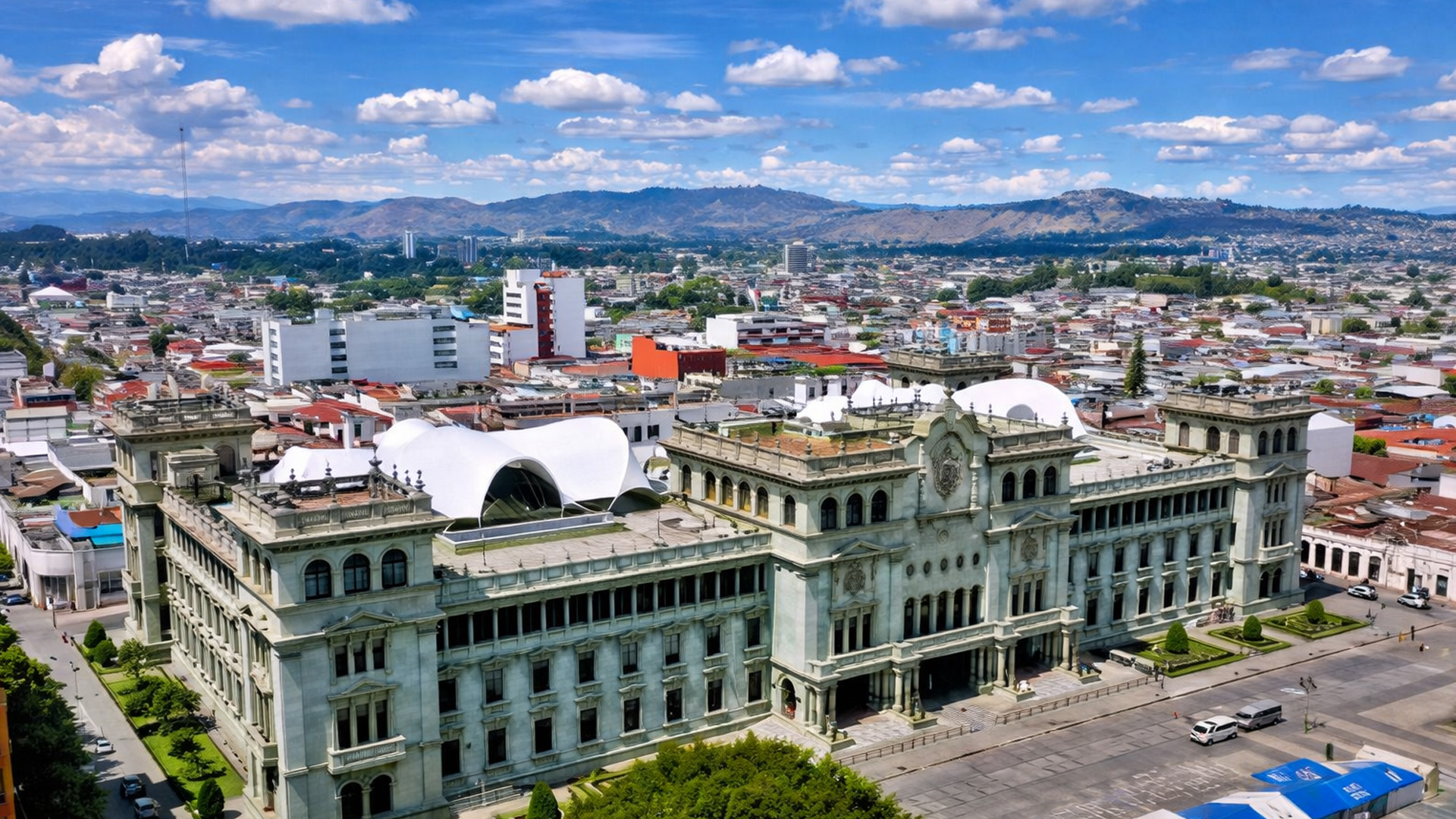 A landmark building surrounded by the city of Guatemala