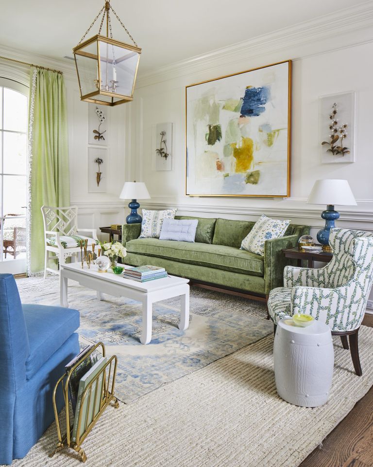 White Loft Space with Green Sofa and Blue Chair