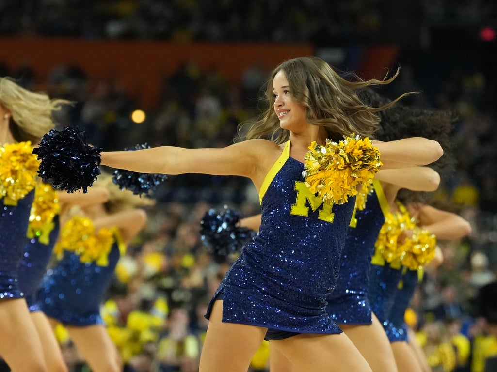 Fantastic photos of March Madness champion Michigan Wolverines cheerleaders