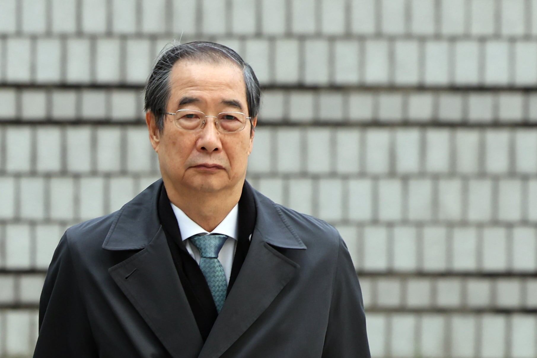 Prosecutors seek 23-year sentence for former PM Han in martial law case