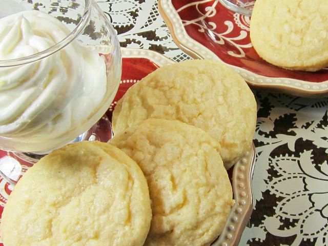 close up view of Vanilla Wafer Cookies on a red plate, with vanilla ice cream in a glass