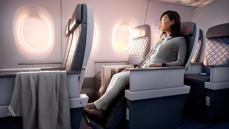 The Hidden Button On Your Airplane Seat That Makes Long Flights Tolerable