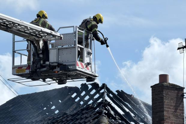 Two men taken to hospital after house fire