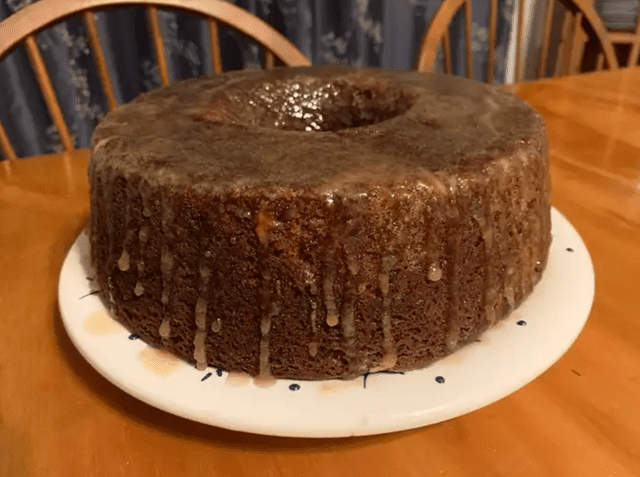 a prune bundt cake on a white plate