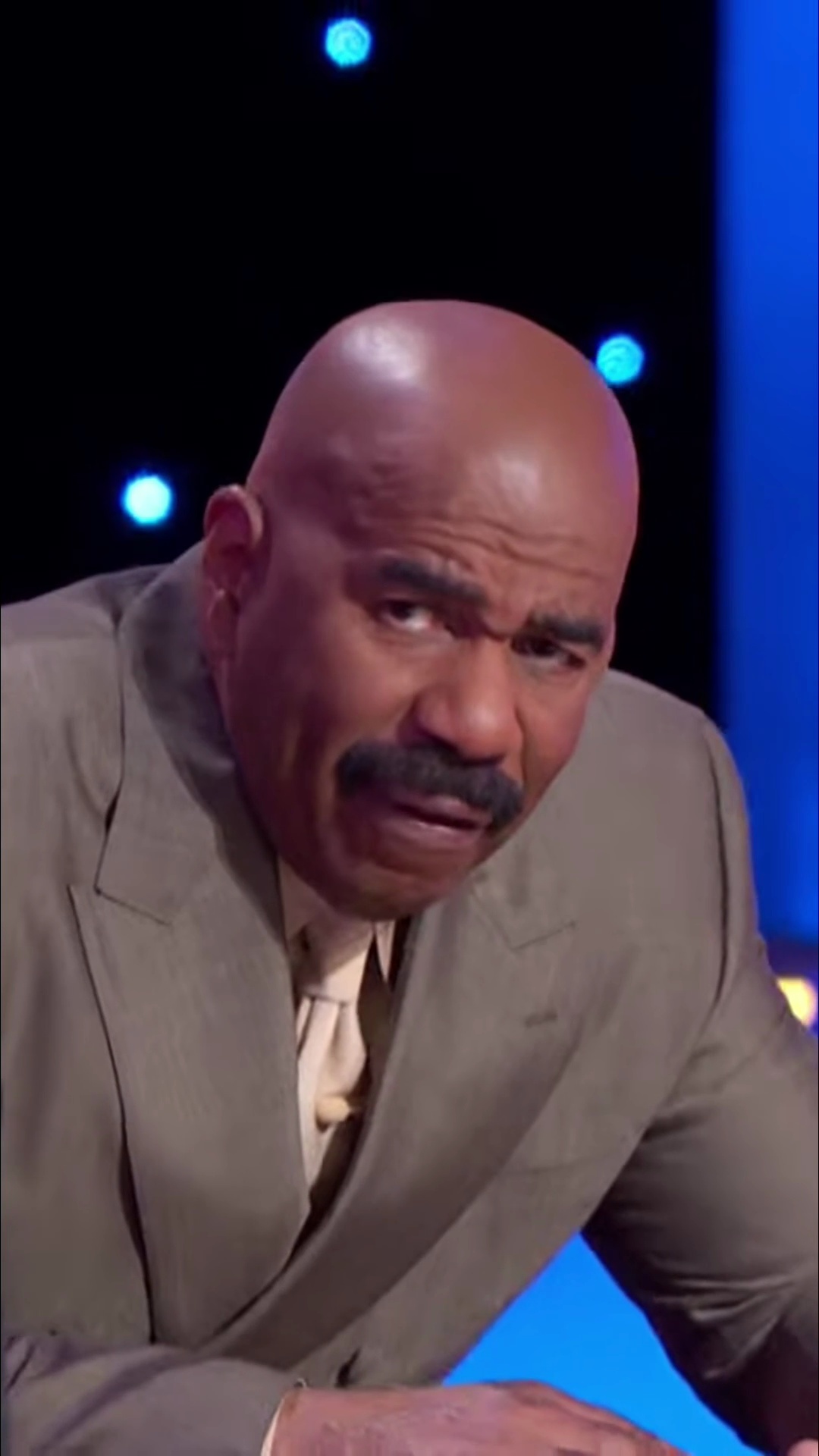 Steve Harvey loses it at the podium on Family Feud