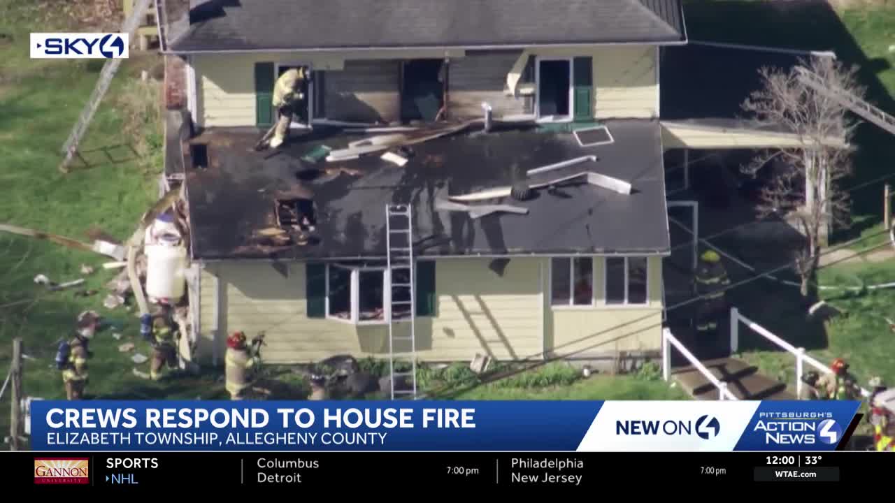 Firefighters battle house fire in Elizabeth Township
