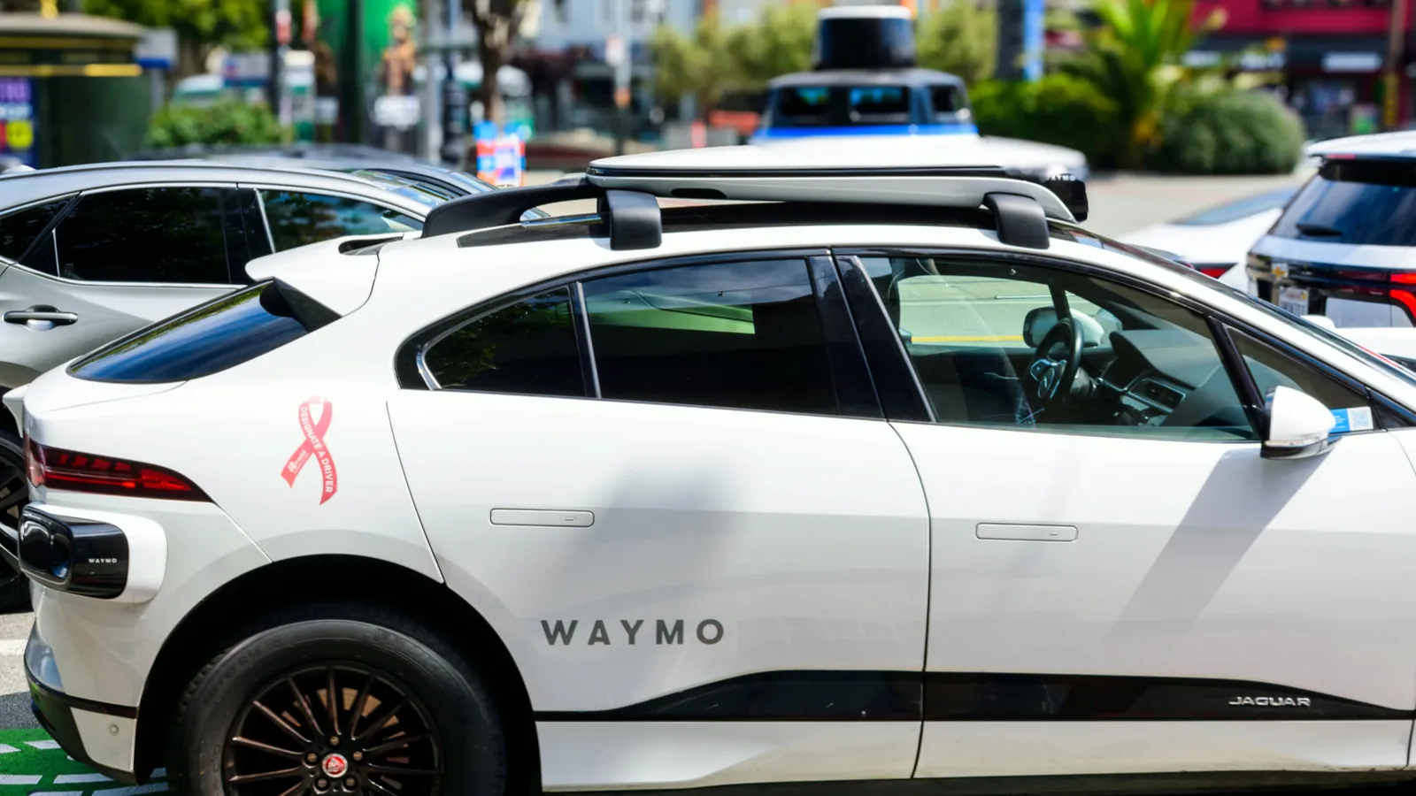 Uber CEO says Tesla will eventually get to a viable scale but sticks ...