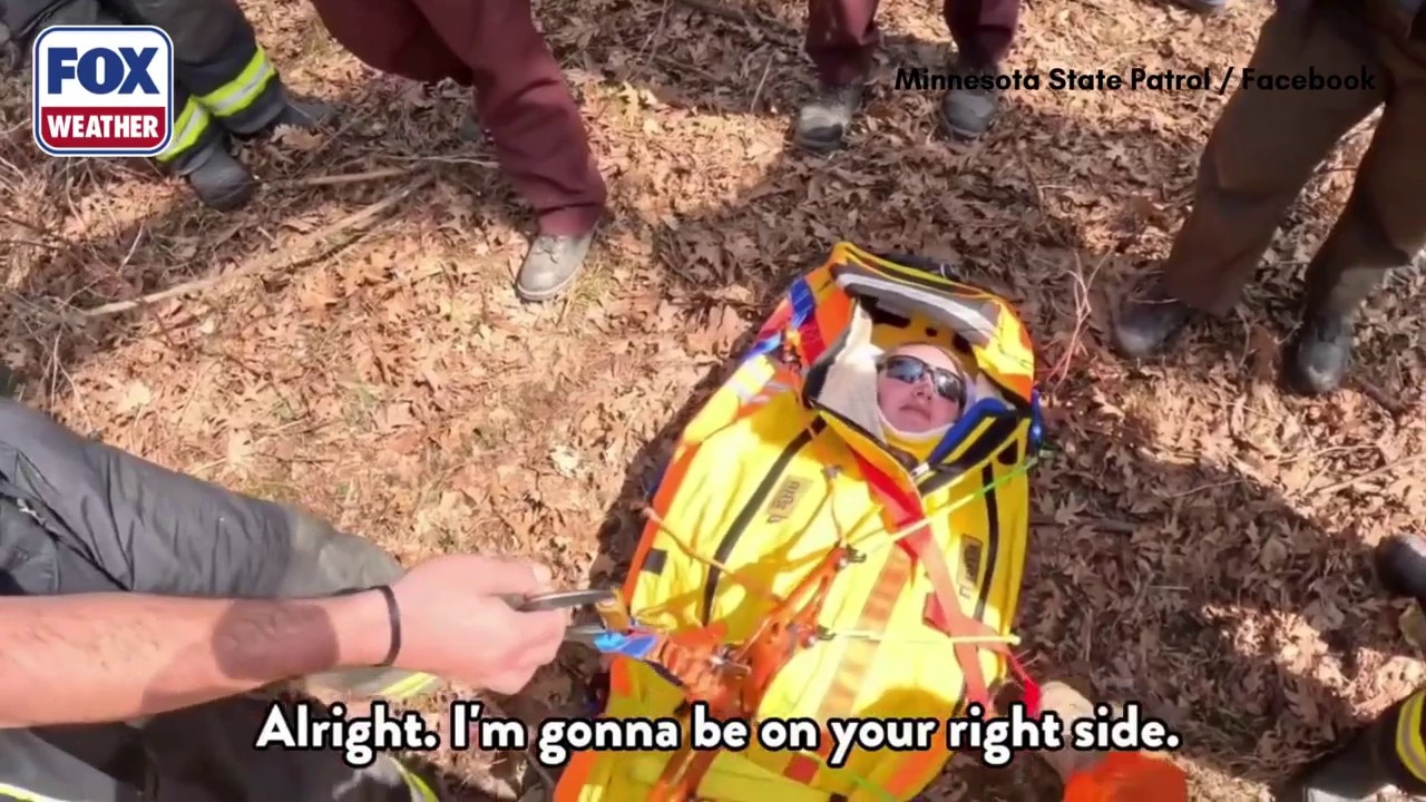 Watch: Minnesota conservation officer rescued after near 20-foot fall ...