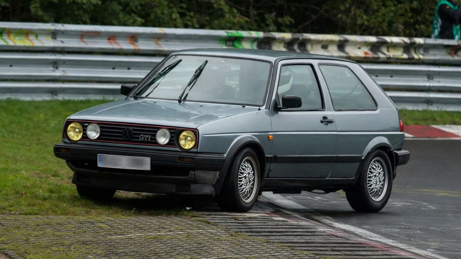 Rainy Nürburgring sessions show cars sliding off corners