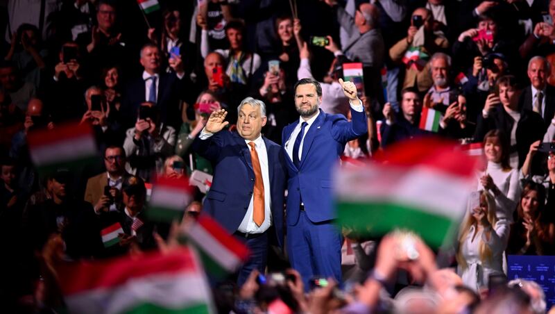 Hungary's Prime Minister Viktor Orban, left, and U.S. Vice President JD Vance gesture at the end of a pre-election rally in Budapest, Hungary, Tuesday, April 7, 2026.