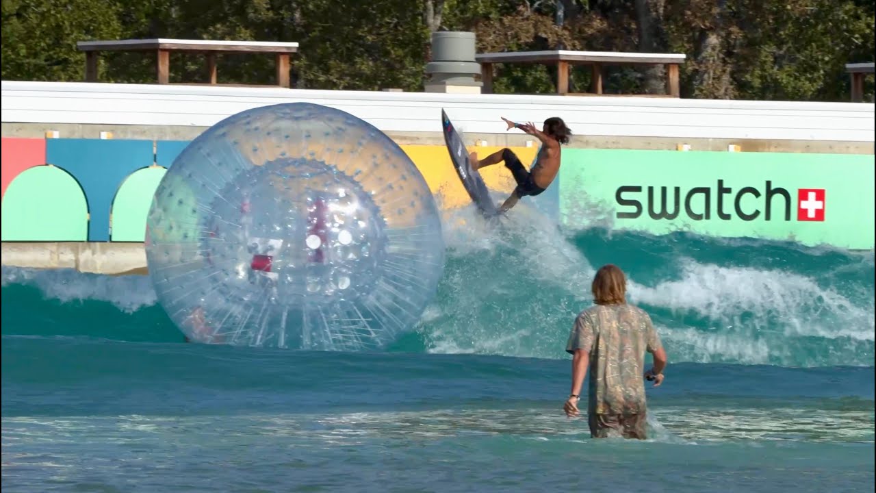 Pro surfers showcase their skills in a wave pool environment