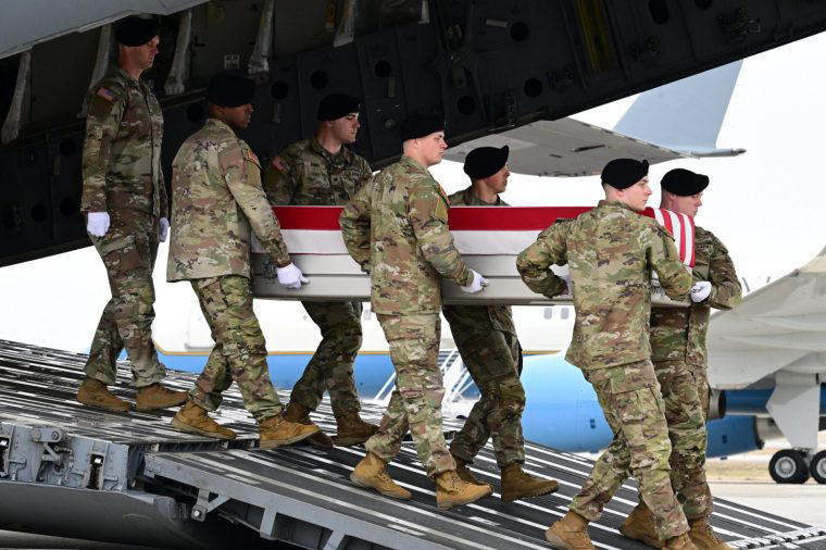 A US Army carry team in Delaware, US, on 7 March, moves the flag-draped coffins of US soldiers killed in an Iranian strike on Kuwait’s Port of Shuaiba (Photo: Kyle Mazza/Anadolu)