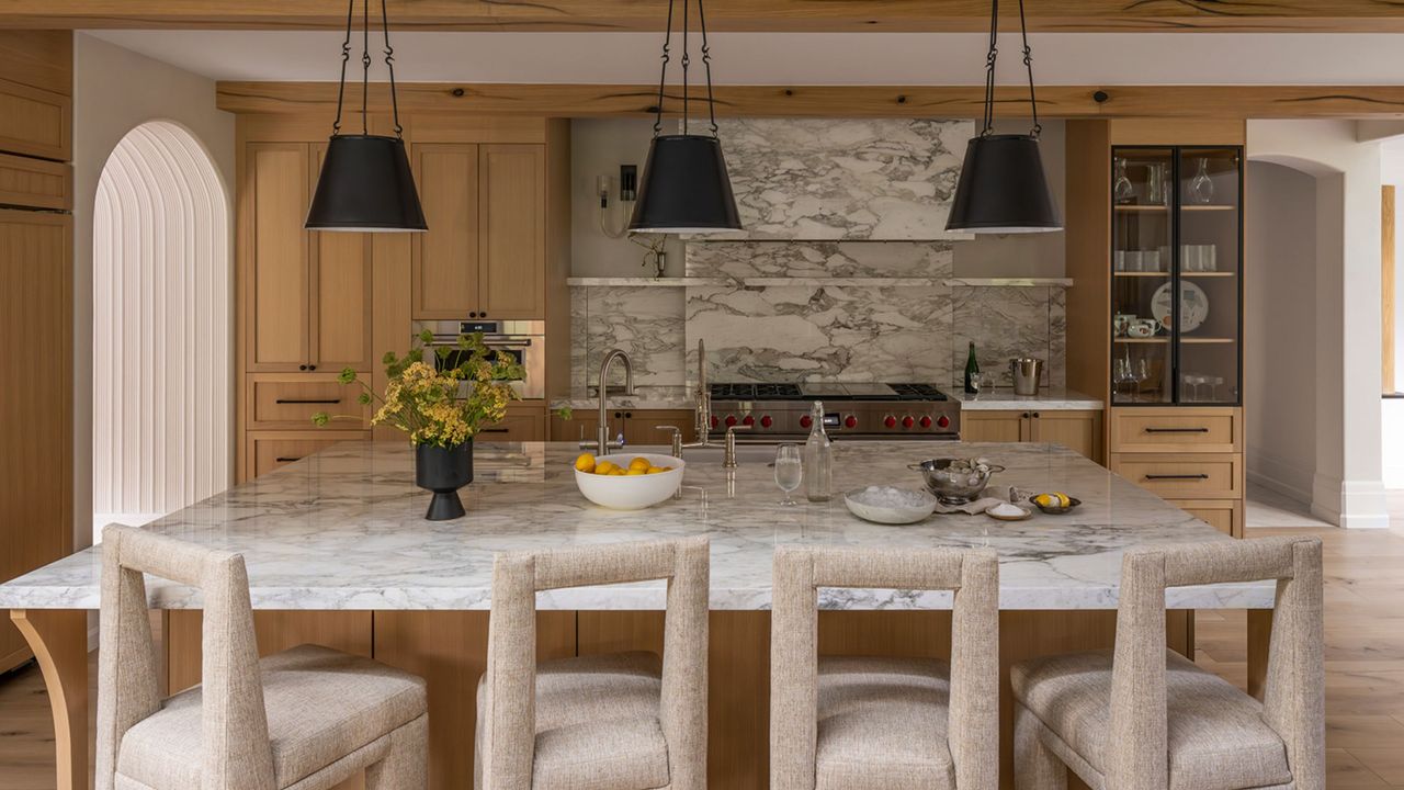 A timeless kitchen defined by asymmetry, hidden storage, and unexpected ...