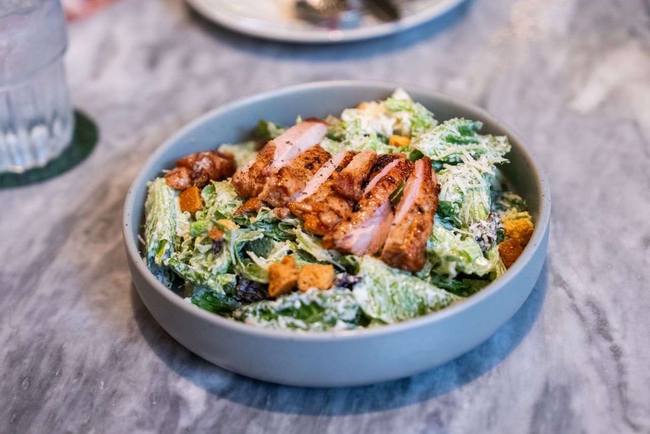 Salad topped with chicken