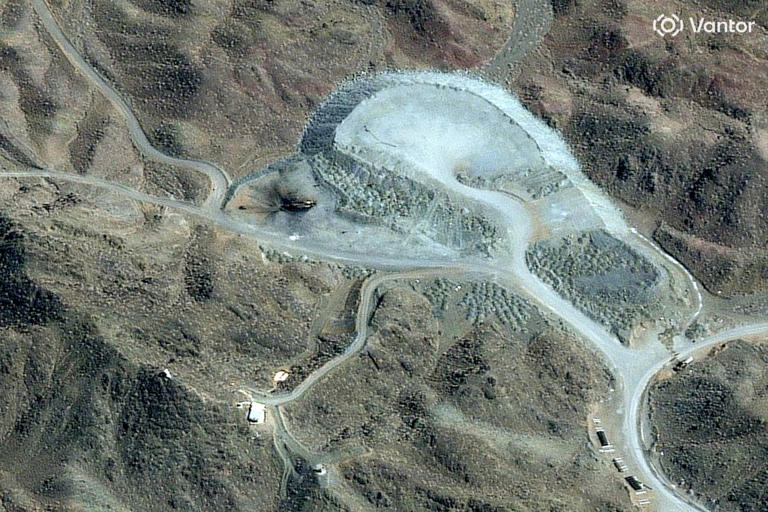 A satellite image shows destruction at an Iranian tunnel complex adjacent to a nuclear facility.