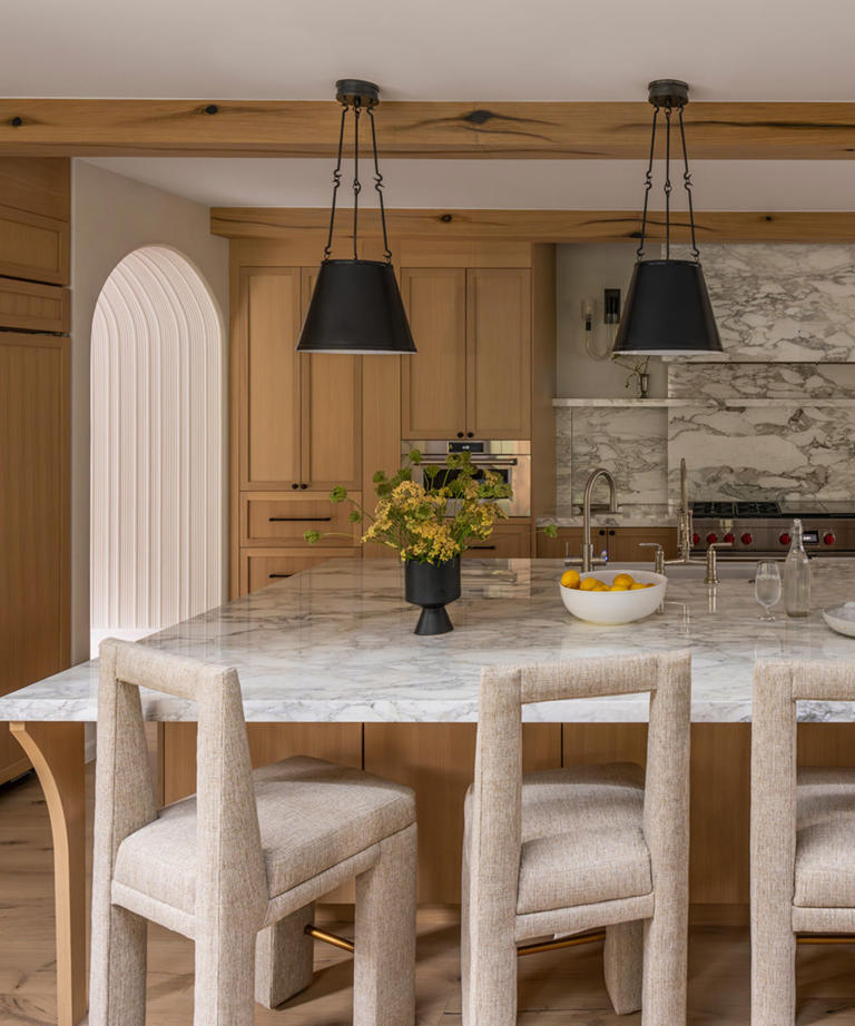 A timeless kitchen defined by asymmetry, hidden storage, and unexpected ...