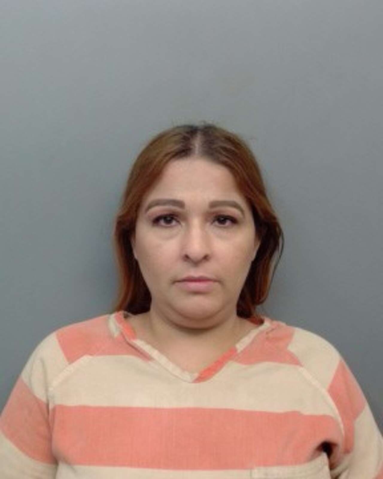 Woman arrested after leaving child in 100-degree car while grocery shopping