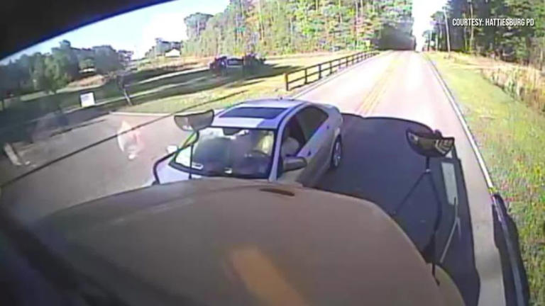 Video: Driver crashes into school bus moments after students cross road